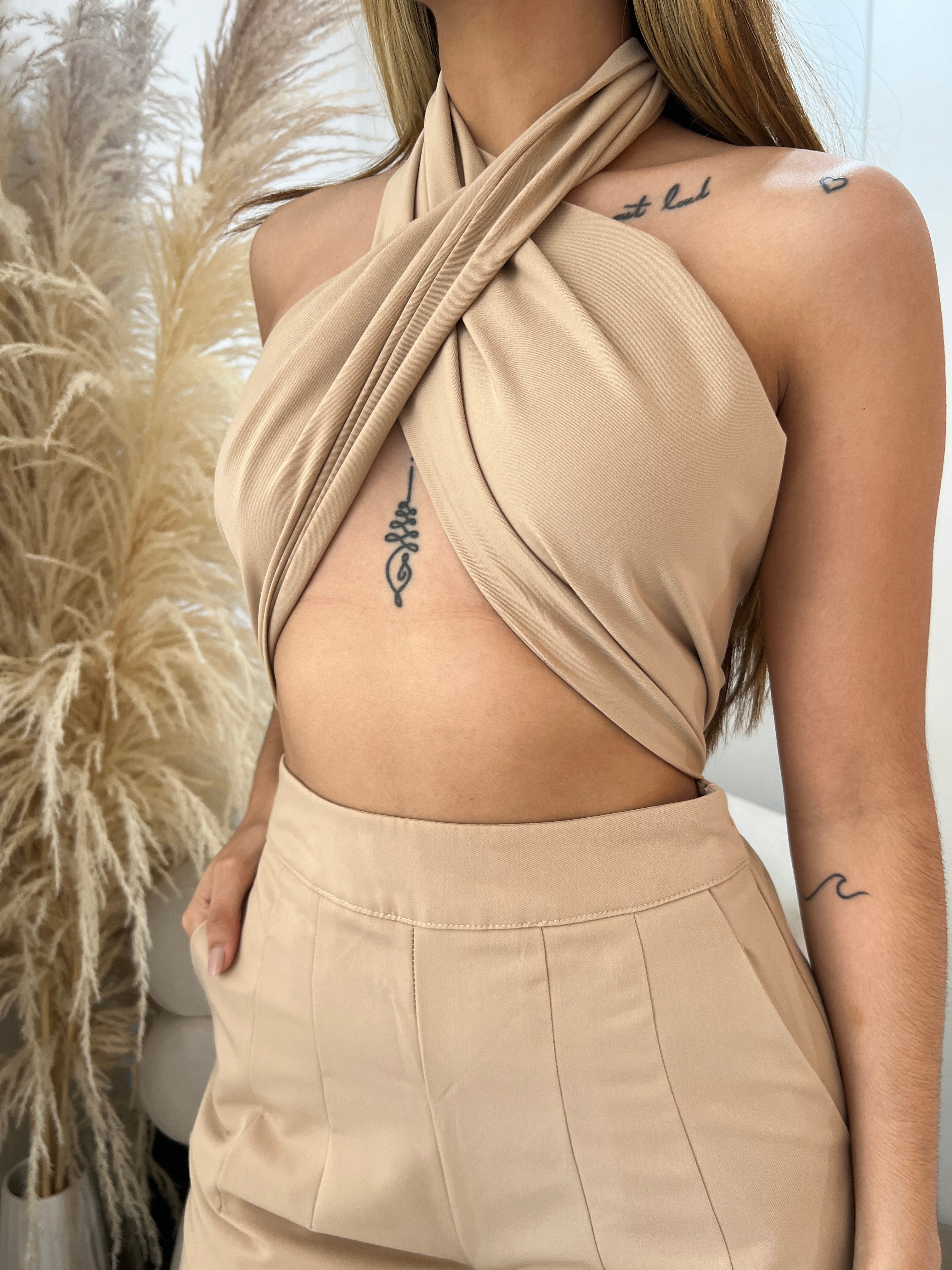 Pants that become a Beige jumpsuit